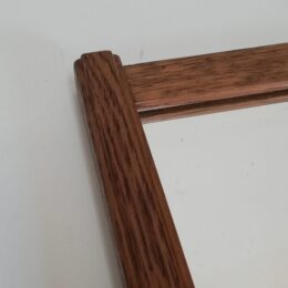 Oud spiegeltje met houten lijst